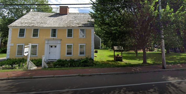 Historic Stetson House in Hanover, MA, with a comfortable car service vehicle ready for reliable local transportation.